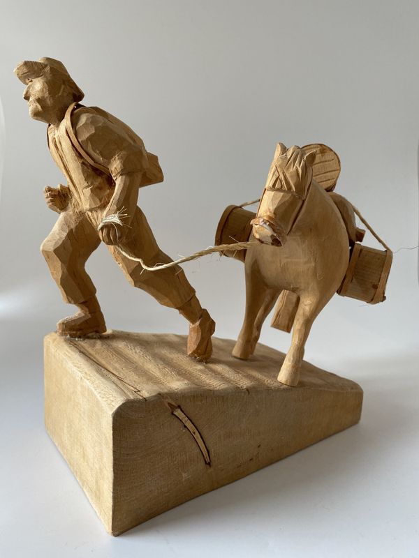 Mann med kløvhest treskjærerarbeid 